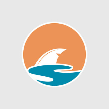 Abstract travel logo with ocean and shark fin.  Shark fin icon. 