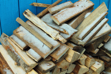 Firewood stacked in a pile. Background.