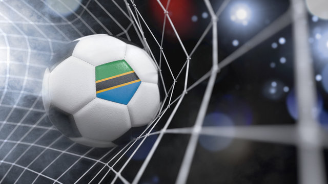 Realistic soccer ball in the net with the flag of Tanzania.(series)