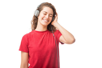 Fototapeta premium Woman listening to her favorite songs