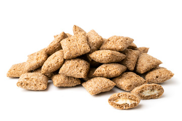 A bunch of biscuits, the milk in the box on a white, closeup.