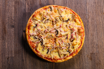 Pizza with ham and mushrooms