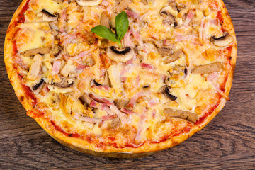 Pizza with ham and mushrooms
