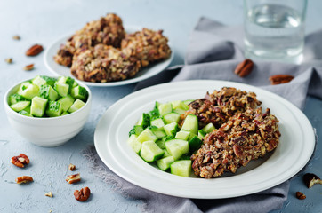 Pecan crust chicken breasts with cucumber's slices
