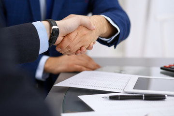 Obraz premium Business people shaking hands, finishing up a meeting. Audit, tax service or agreement concept