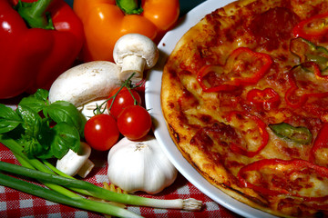delicious pizza and fresh vegetables