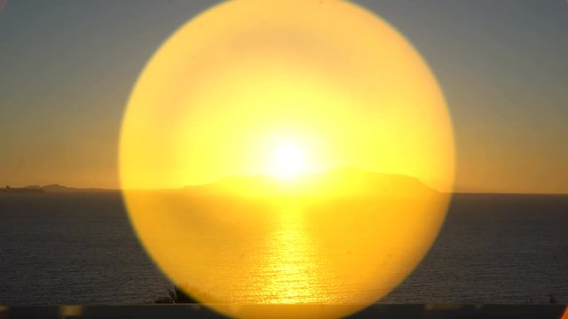 Rising Sun over the sea and desert mountains