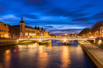 Paris by night, river Seine, illuminated street and building, France