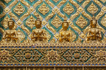 Fototapeta na wymiar Mosaic encrusted wall of the Phra Mondop library building on the grounds of the Grand Palace Bangkok Thailand.