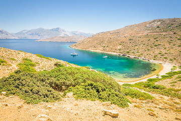 Beautiful sunny holiday coast view to the greek blue sea with crystal clear water beach relaxing...