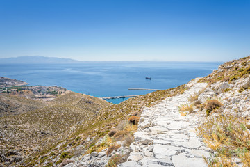 Beautiful sunny holiday view to the greek beach blue sea with crystal clear water beach with some...