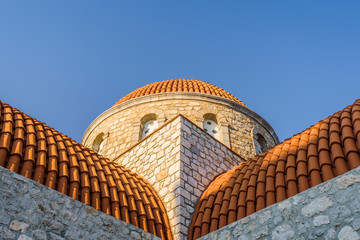 Beautiful mediterranean greek colorful holy monastery Agios Savvas situated on a mountain high...