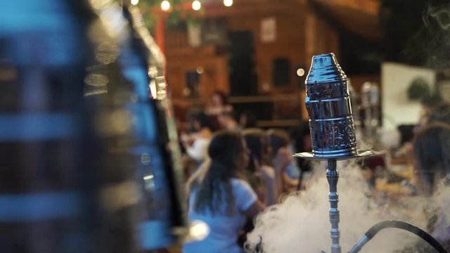 Hookah with smoke in outdoor bar