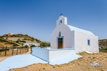 Beautiful white blue greek church monastery with amazing views to the sea situated in a small greek...