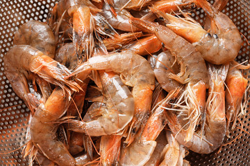 Colander with fresh shrimps, closeup