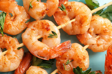 Skewers with delicious fried shrimps, closeup