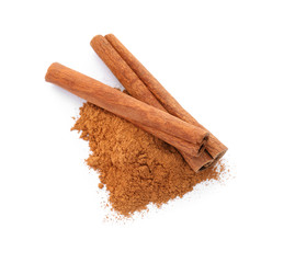 Aromatic cinnamon sticks and powder on white background