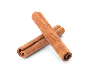 Aromatic cinnamon sticks on white background