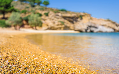 Beautiful sunny coast view to the greek blue sea with crystal clear water beach with some boats...