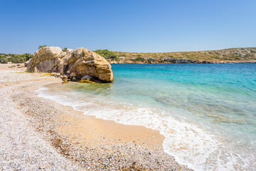 Beautiful sunny coast view to a small greek village harbor white houses with crystal clear blue...