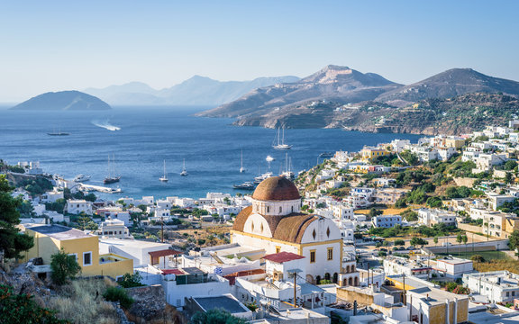 Beautiful mediterranean greek village Pantelis sourrounded by a mountain with ancient castle located at the aegean sea with colorful houses and lovely churches basilicas, Leros, Dodecanese, Greece