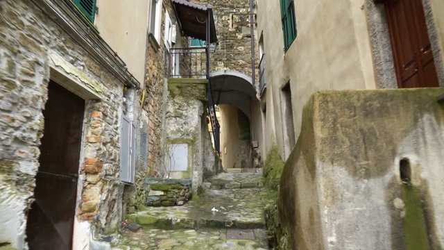 A narrow pedestrian street in the old town of Perinaldo, Imperia province, Liguria region, Italy