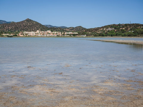 Pond of Notteri in Villasimius and in the background the tourist resort Tanka Village, Sardinia.