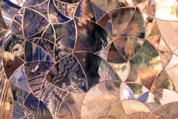 Background formed by colored glass pieces joined together like a mosaic.