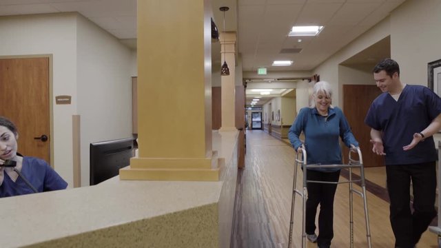 Medium shot of a senior woman using a walker