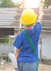 Engineer and Architect planing and discuss at Construction Site with blueprint