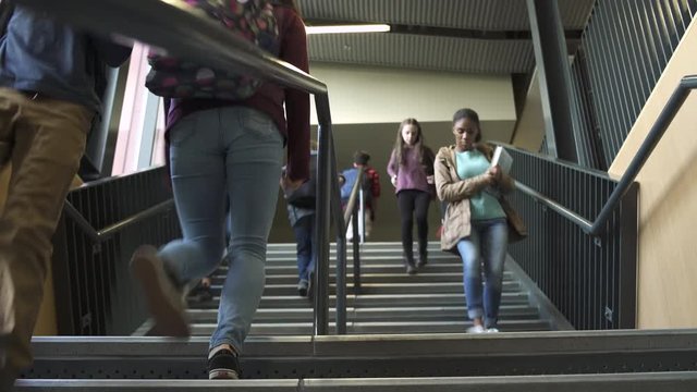 Wide shot of students descending on stairs