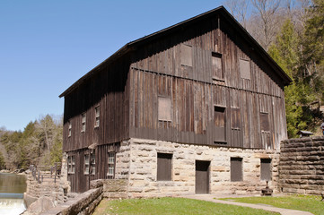 Fototapeta na wymiar PORTERSVILLE, PENNSYLVANIA, USA 4-20-2018 McConnells Mill Grist Mill building. The mill, one of the first in America operated from 1852 to 1928 on Slippery Rock Creek