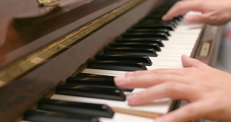 Man playing piano at home