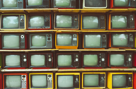 Pattern wall of pile vintage television (TV) - vintage filter effect style. retro technology.