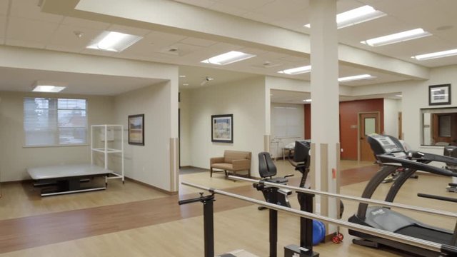 Wide shot of a rehabilitation gym at daytime