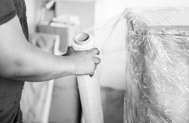 Black man moving furniture