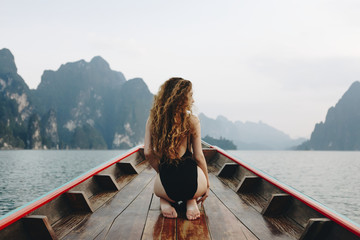 Beautiful woman posing on a boat