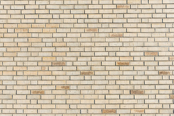 Background from a new beige brick wall