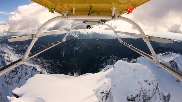 Aerial Helicopter Skids View Flyover Snowy Mountain Top Cascade Mountain Range Ridge Three Fingers