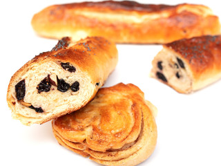 Buns with raisins and jam on a white background