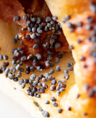 Poppy seeds in a bun as a background