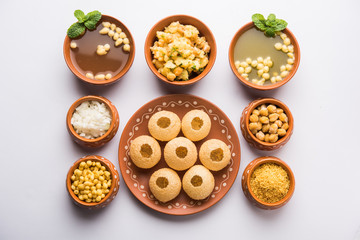 Pani Puri is Indian chat item served in a terracotta bowls and plate   © StockImageFactory