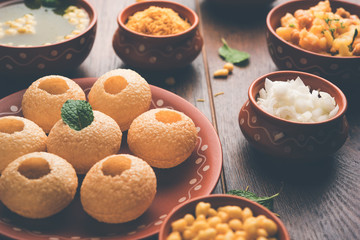 Pani Puri is Indian chat item served in a terracotta bowls and plate   © StockImageFactory