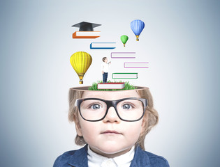 Cute little boy in glasses, education