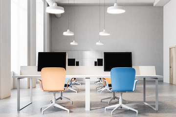 Orange and blue chairs office interior close up