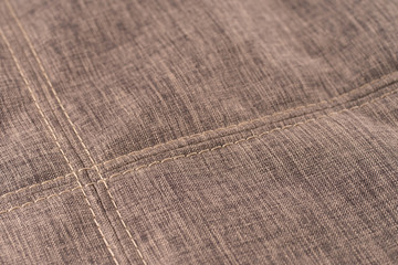 Fabric texture with seam stitch seam.