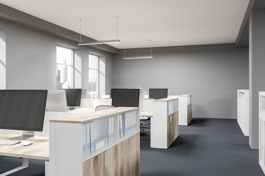 Gray and wooden open space office corner