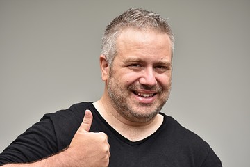 Unshaven Male With Thumbs Up