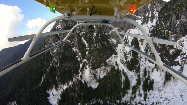 Cascade Mountain Helicopter View Flying Over Snowy Jagged Forest Ridge