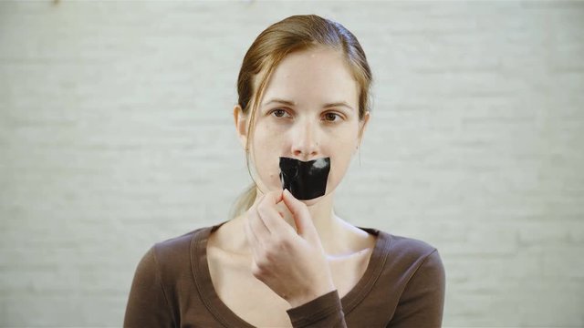 Woman Remove Tape From Mouth 4K